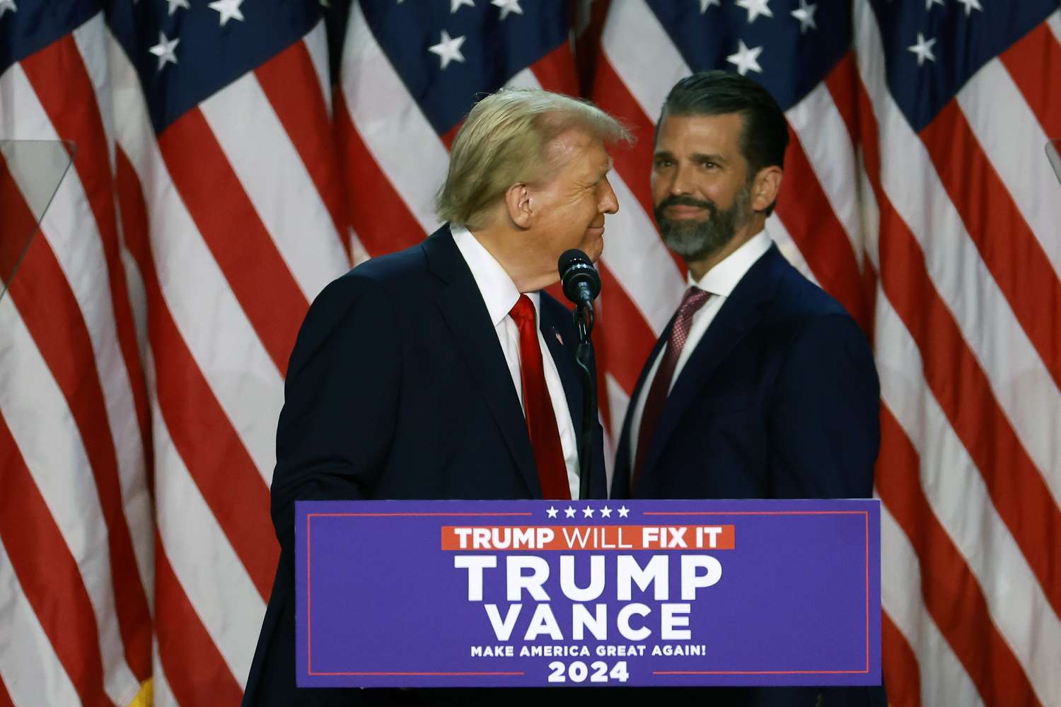 Donald Trump Jr. (R) with his father, President-elect Donald Trump (L)