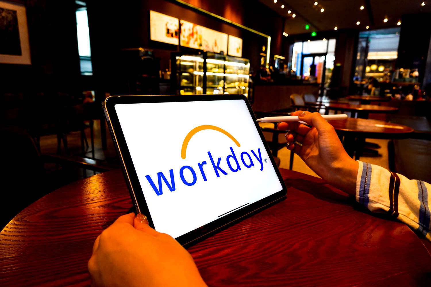 Workday logo is displayed on the screen of an iPad