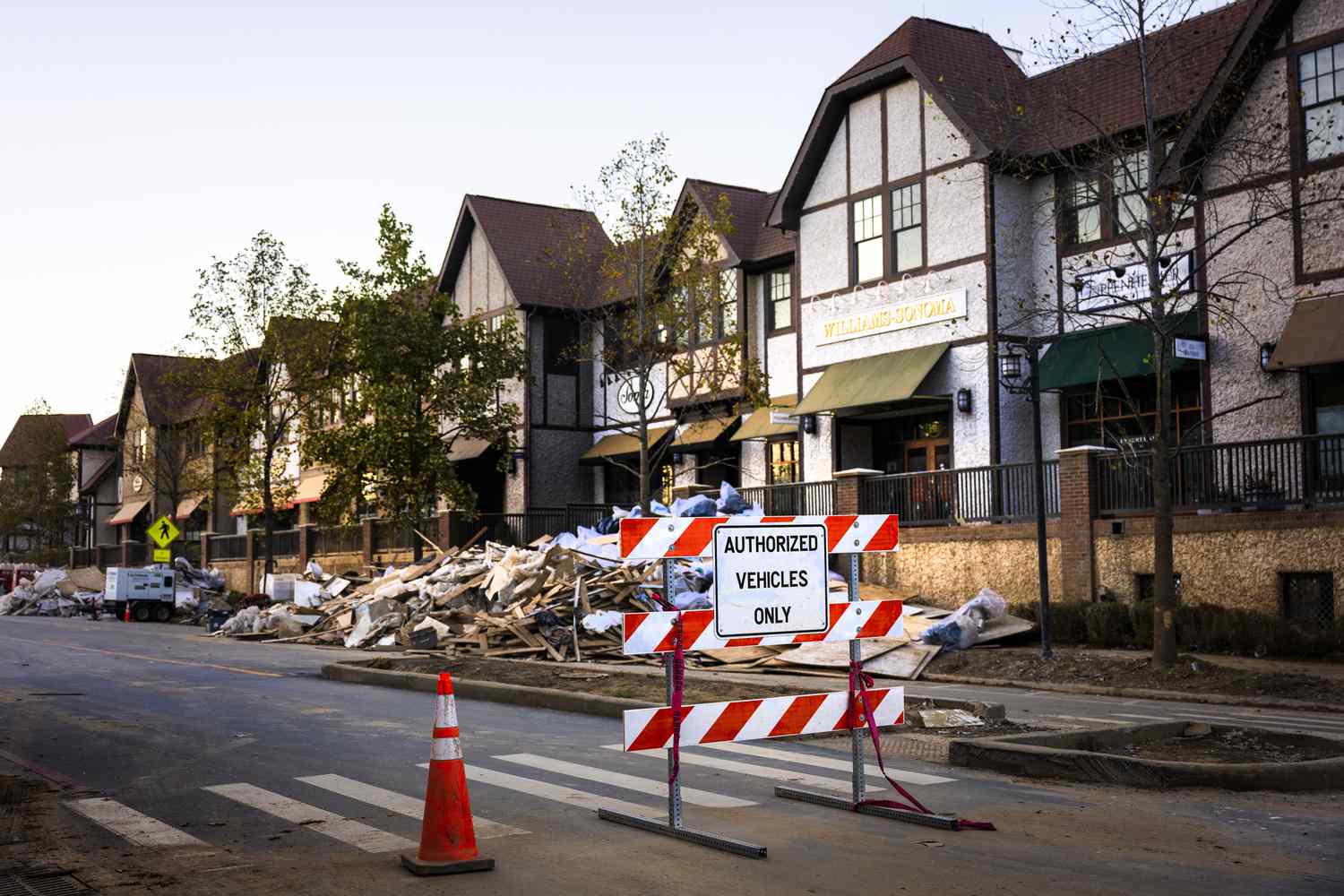 Debris cover the street next to destroyed businesses of Biltmore Village in Asheville. North Carolina, on October 20, 2024