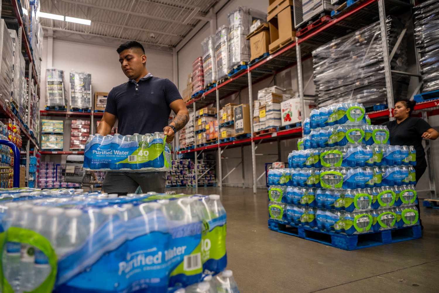 A Sam's Club customer stocks up on bottled water. 