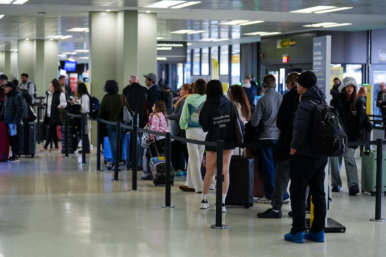 Travelers are seen at the Newark Liberty International Airport (EWR) ahead of Thanksgiving holiday, in New Jersey, United States on November 26, 2024