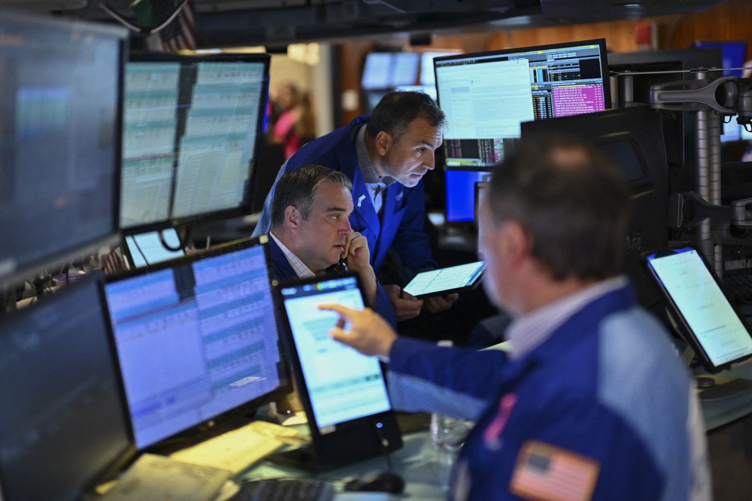 Traders work on the floor of the New York Stock Exchange (NYSE) at the opening bell on November 13, 2024