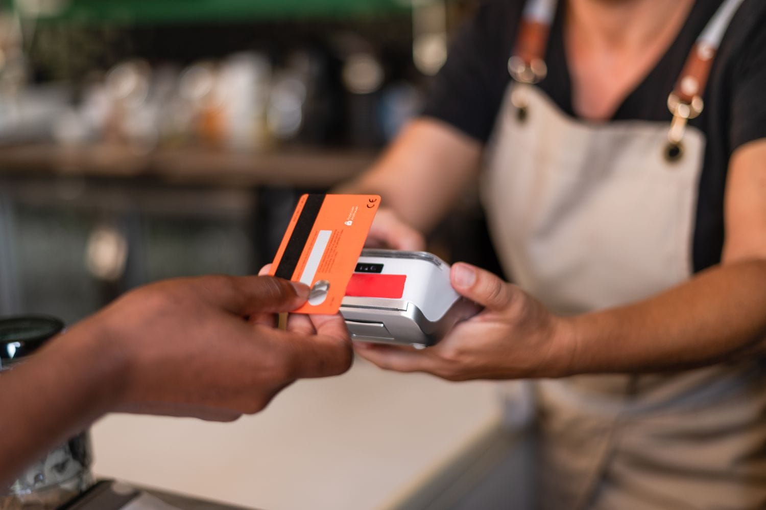 A woman uses a credit card. 