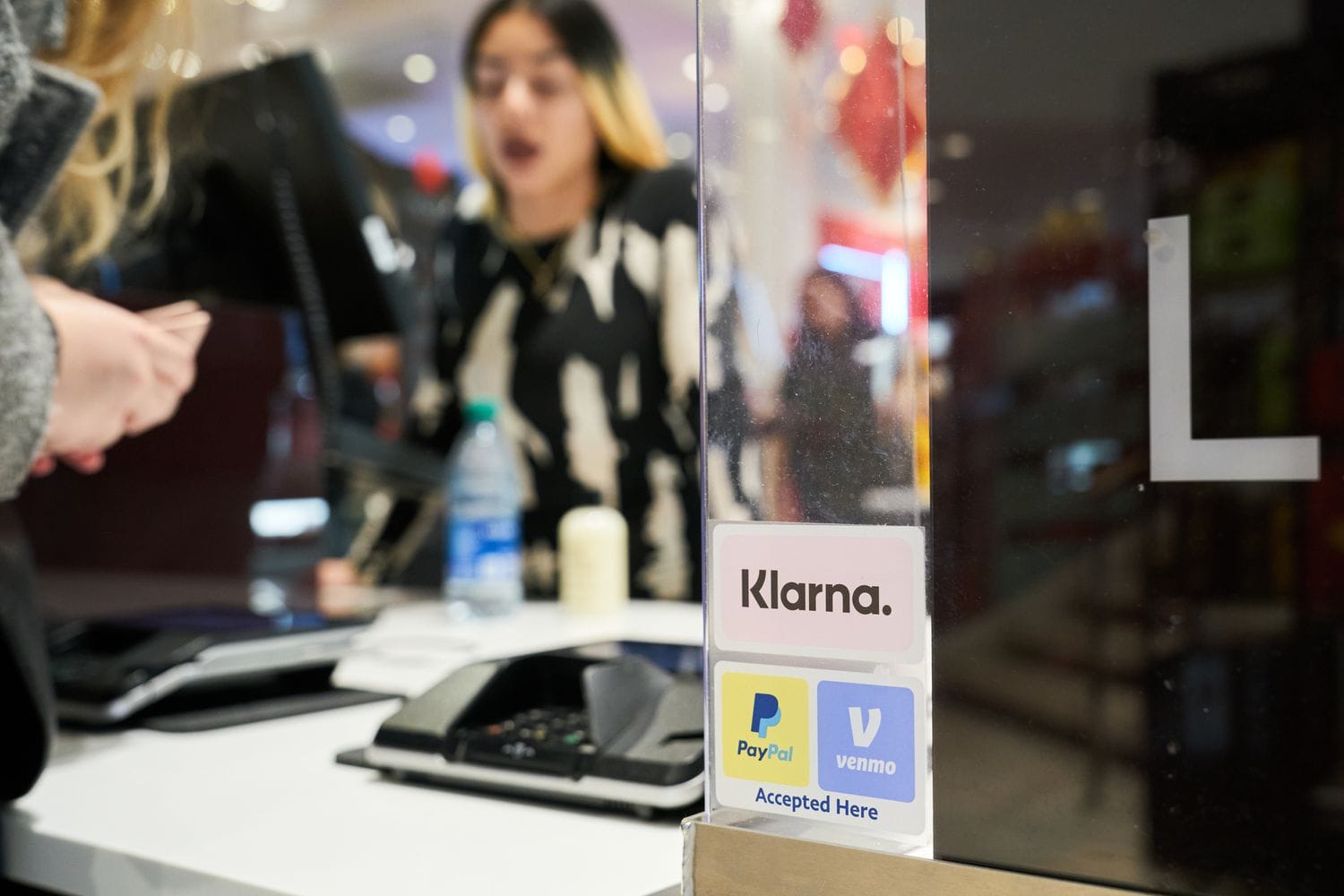 Klarna and other stickers at a Macy's store in November 2023. 