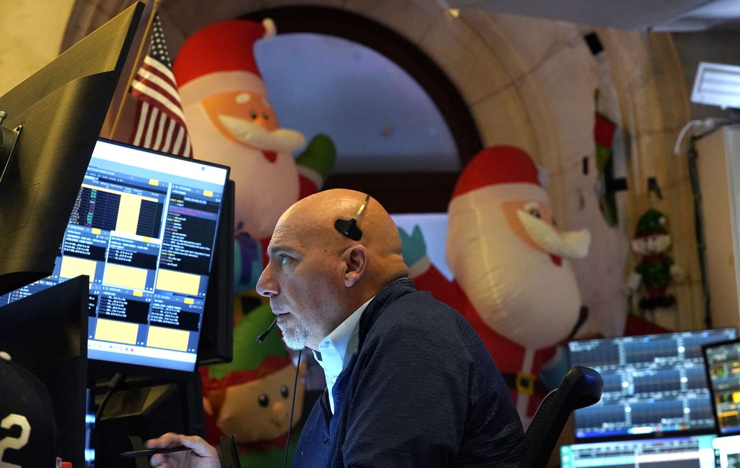 A trader works on the floor of the New York Stock Exchange (NYSE) at the opening bell on November 26, 2024