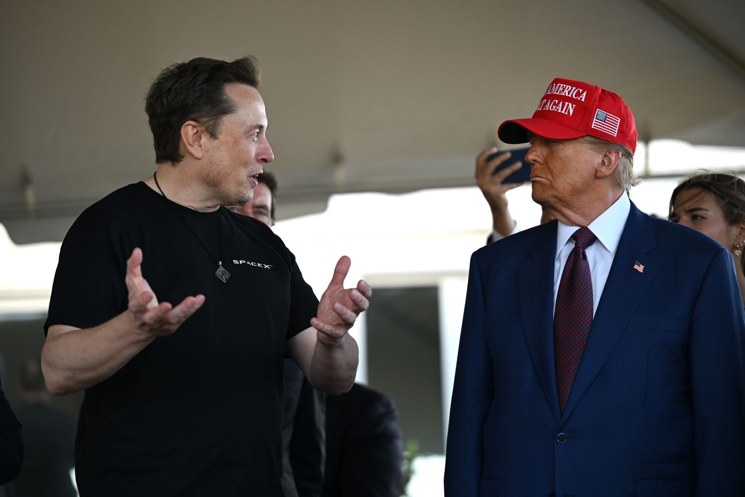 Elon Musk speaks with U.S. President-elect Donald Trump at a viewing of the launch of the sixth test flight of the SpaceX Starship rocket on November 19, 2024 in Brownsville, Texas. 