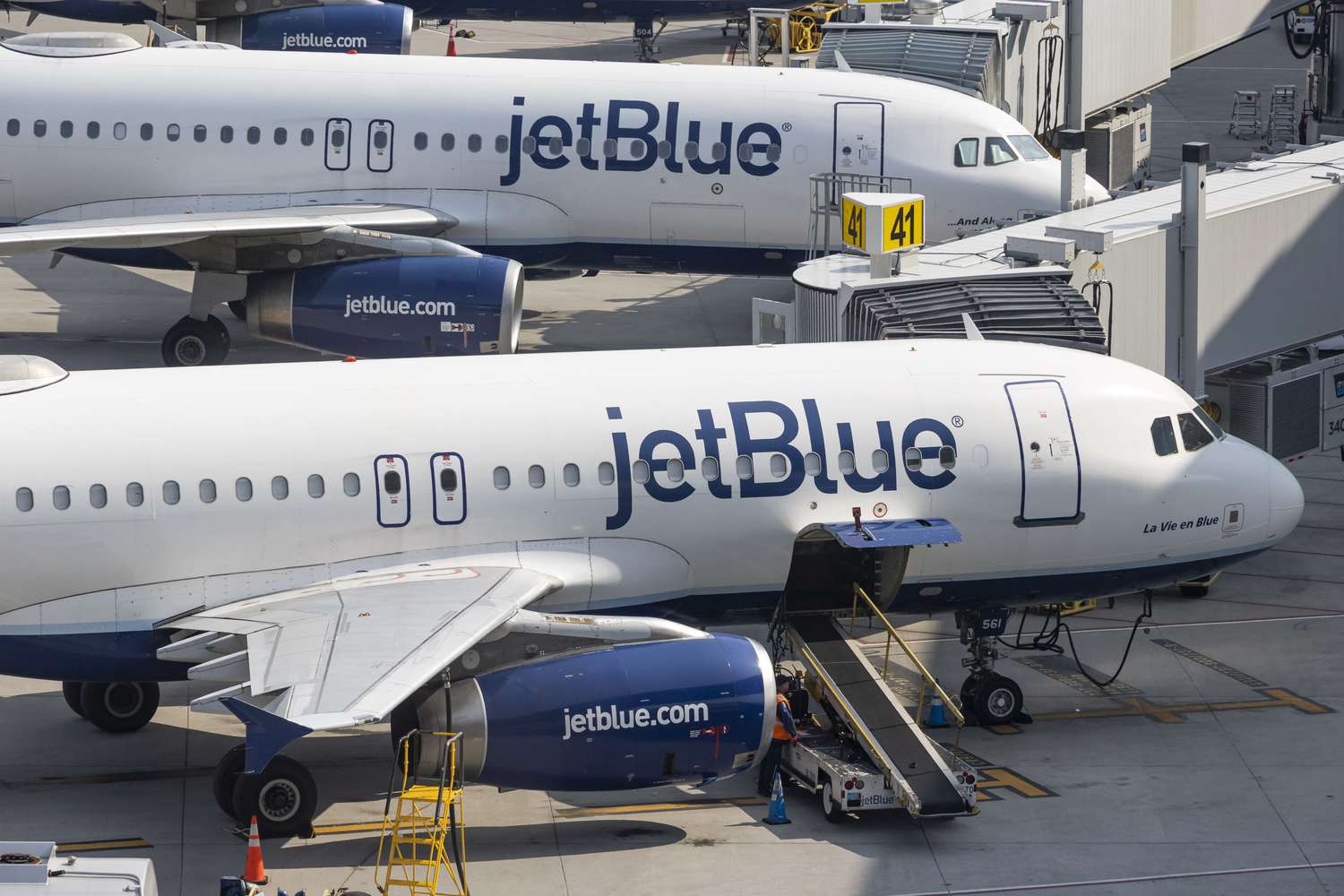 Two JetBlue Airbus A320 jets parked at LaGuardia Airport in New York City