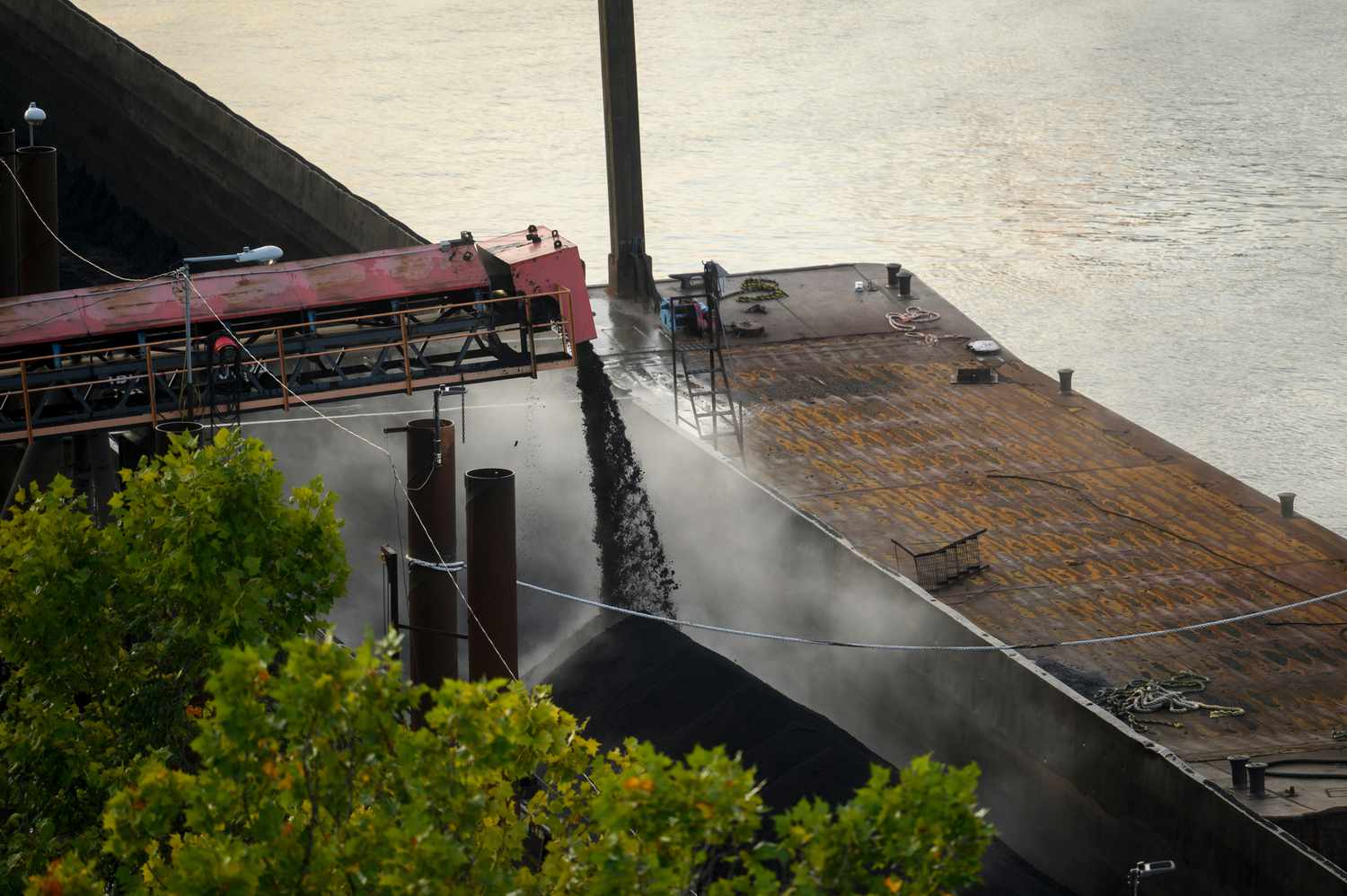 Coal is loaded onto a barge near the United States Steel Corp. Clairton Coke Works facility in Clairton, Pennsylvania