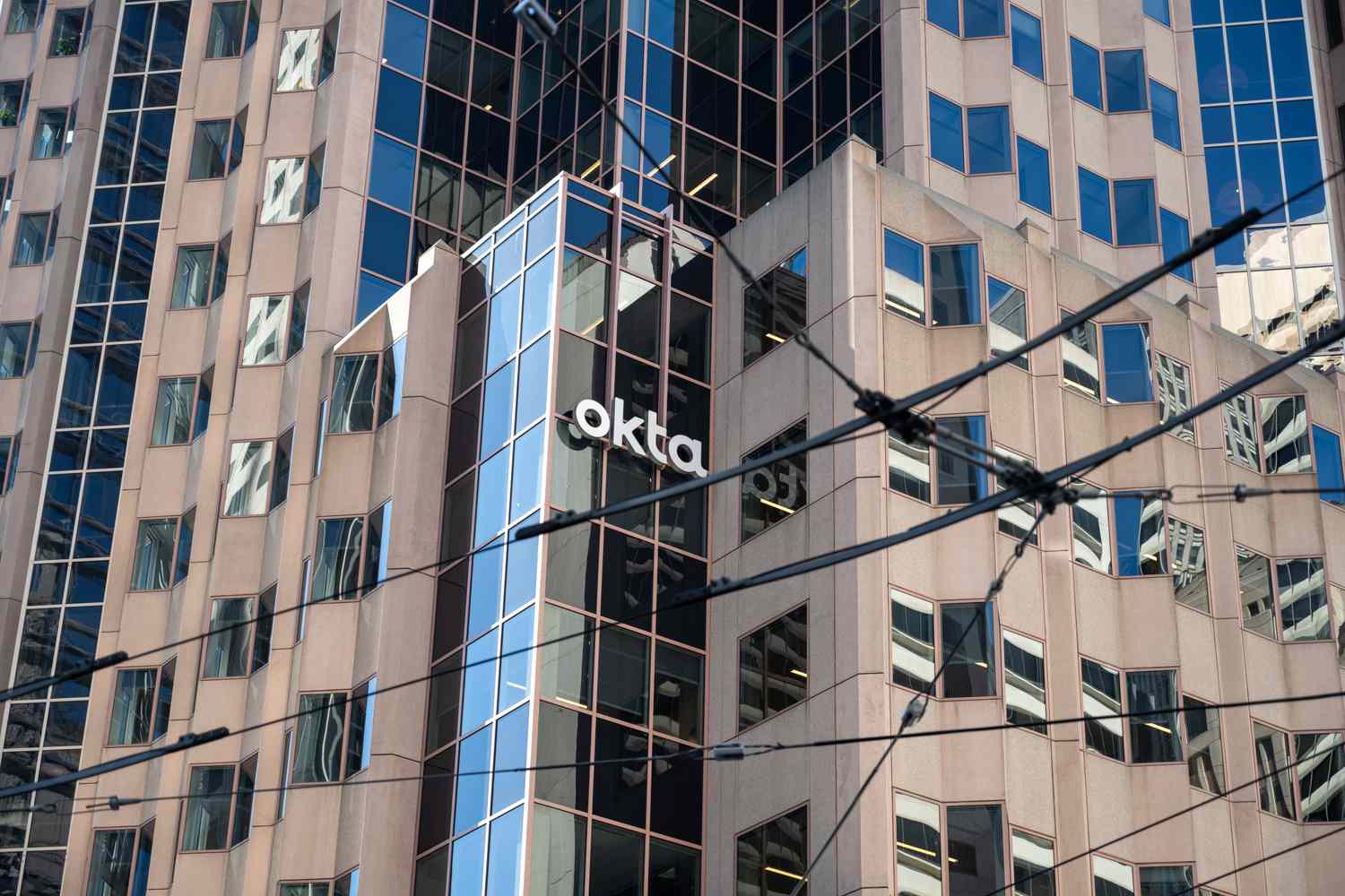 Facade of Okta office building with visible logo, San Francisco, California