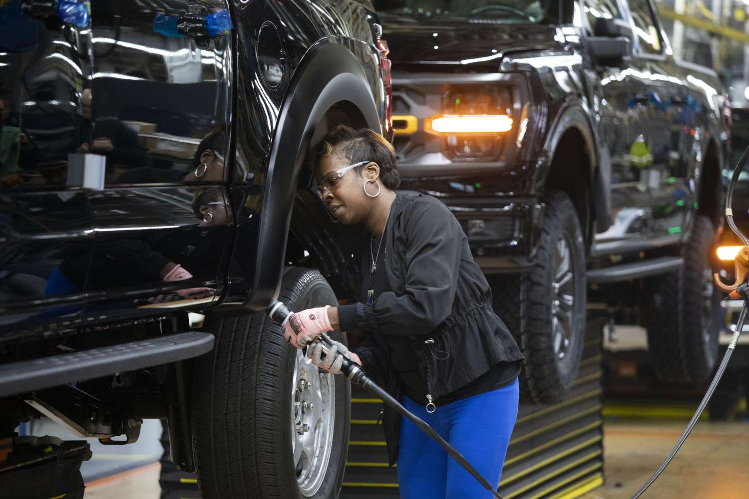 Ford worker LaShunta Harris works on a new Ford F-150 truck as it goes through the assembly line at the Ford Dearborn Plant on April 11, 2024 in Dearborn, Michigan.