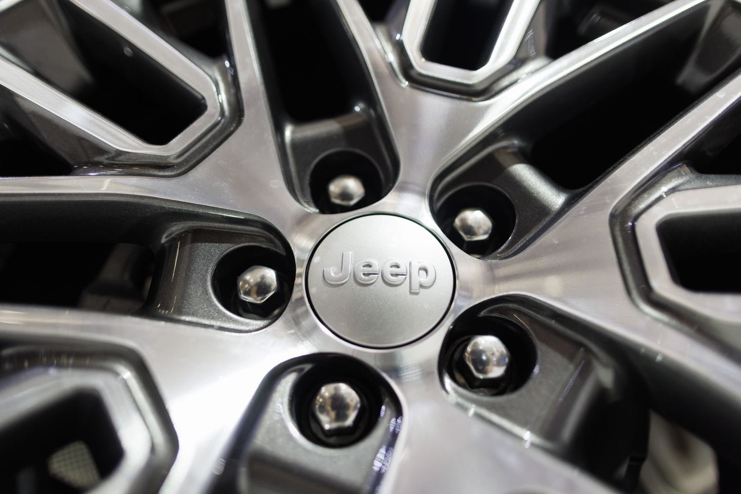 A Jeep logo on a wheel rim at an auto show in February. 