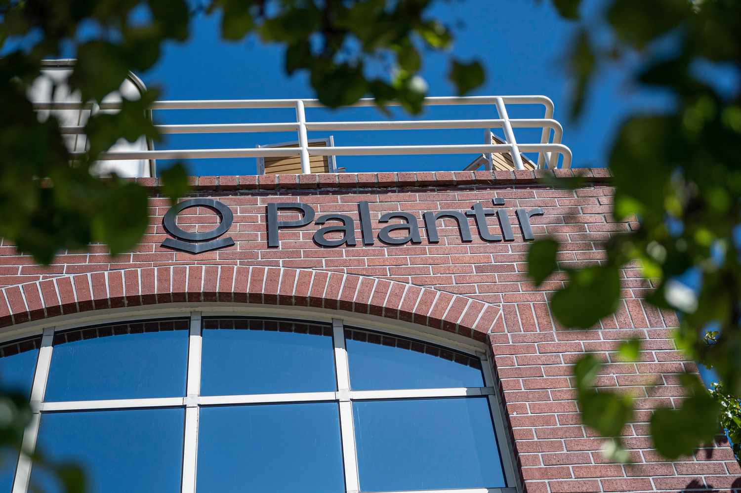 The Palantir logo on display on a company building.