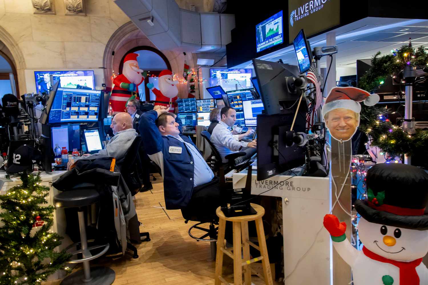 Traders amid Christmas decorations on the New York Stock Exchange in early December. 