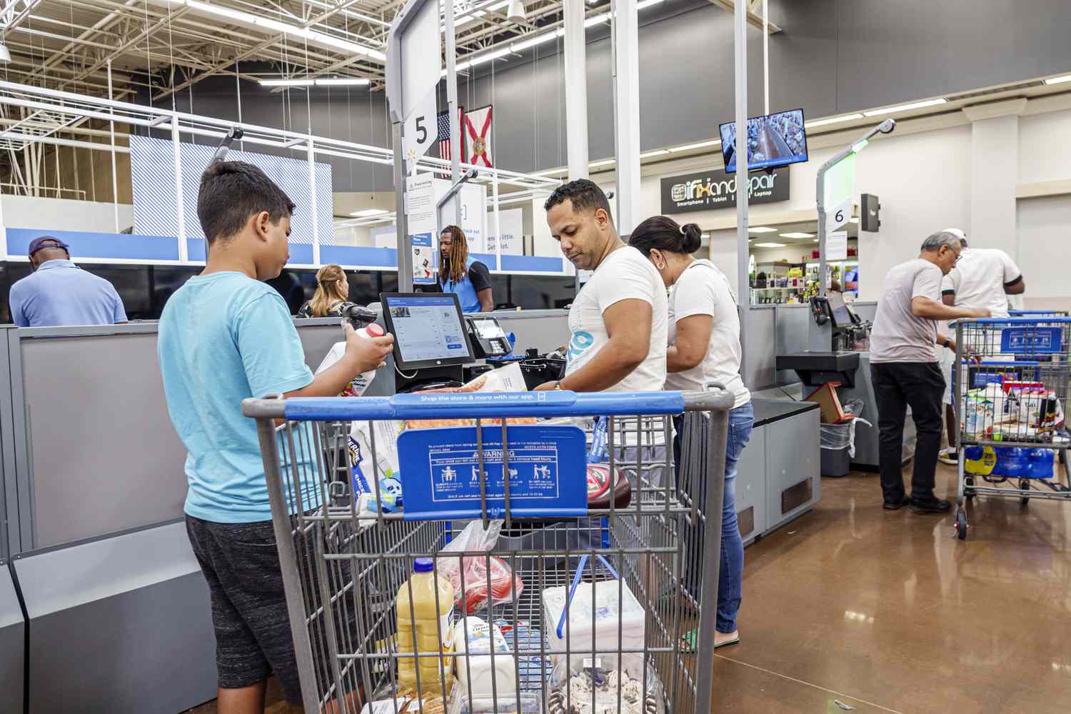 North Miami Beach, Florida, Walmart customer using Self Checkout. 