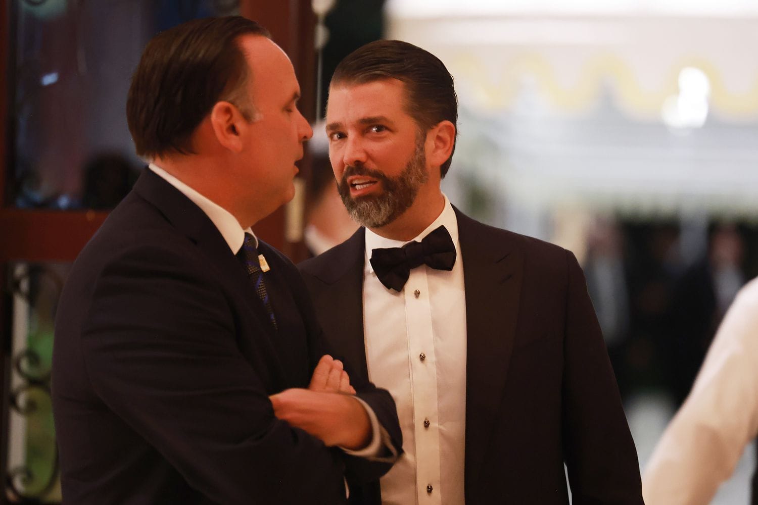 Donald Trump Jr. speaks with other guests at the America First Policy Institute Gala held at Mar-a-Lago.