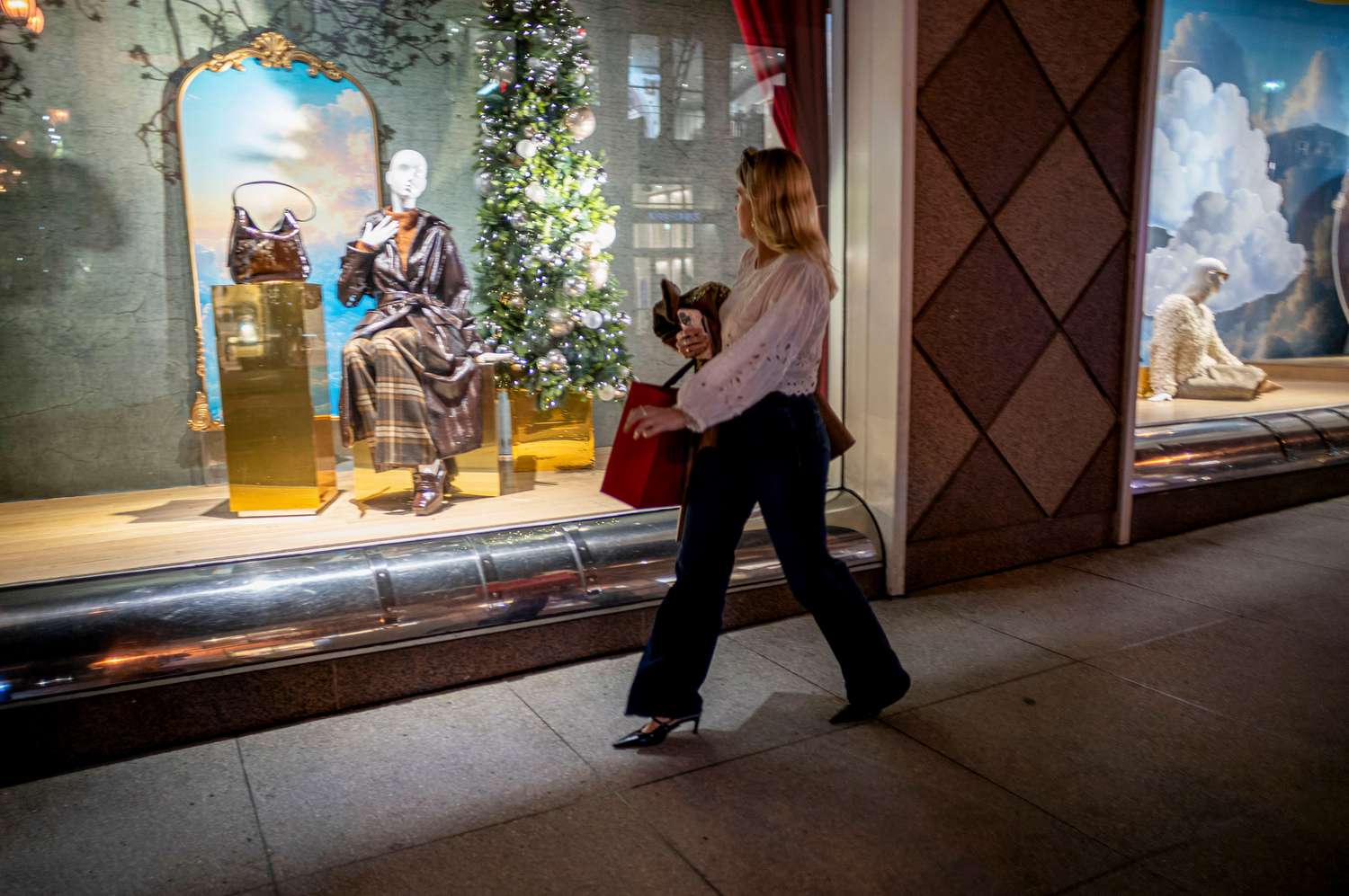 A shopper carries a bag in the Union Square area of San Francisco, California, US, on Thursday, Dec. 5, 2024. 