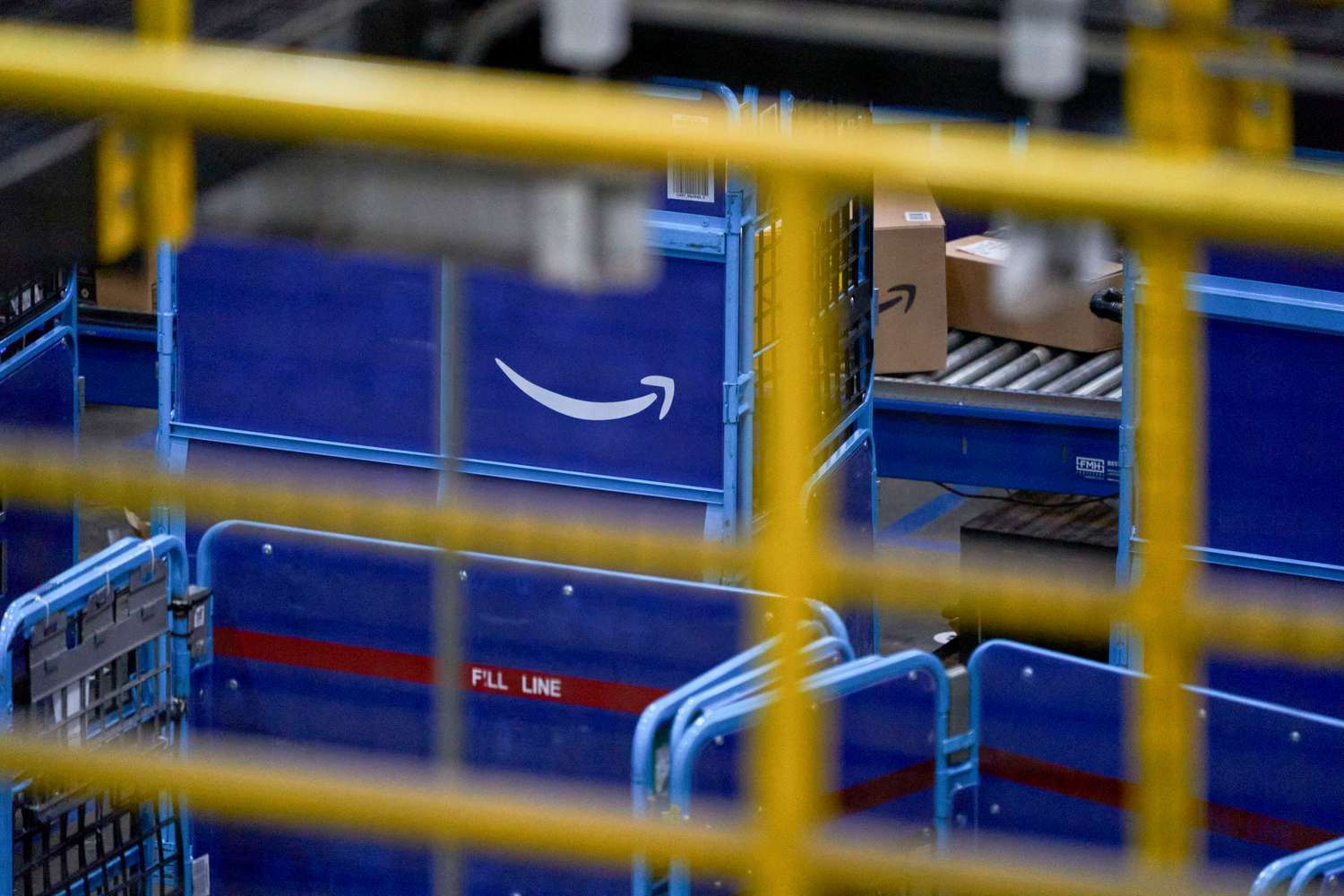 The Amazon logo on package carts at an Amazon Fulfillment center on Cyber Monday in Robbinsville, New Jersey, on Dec. 2, 2024