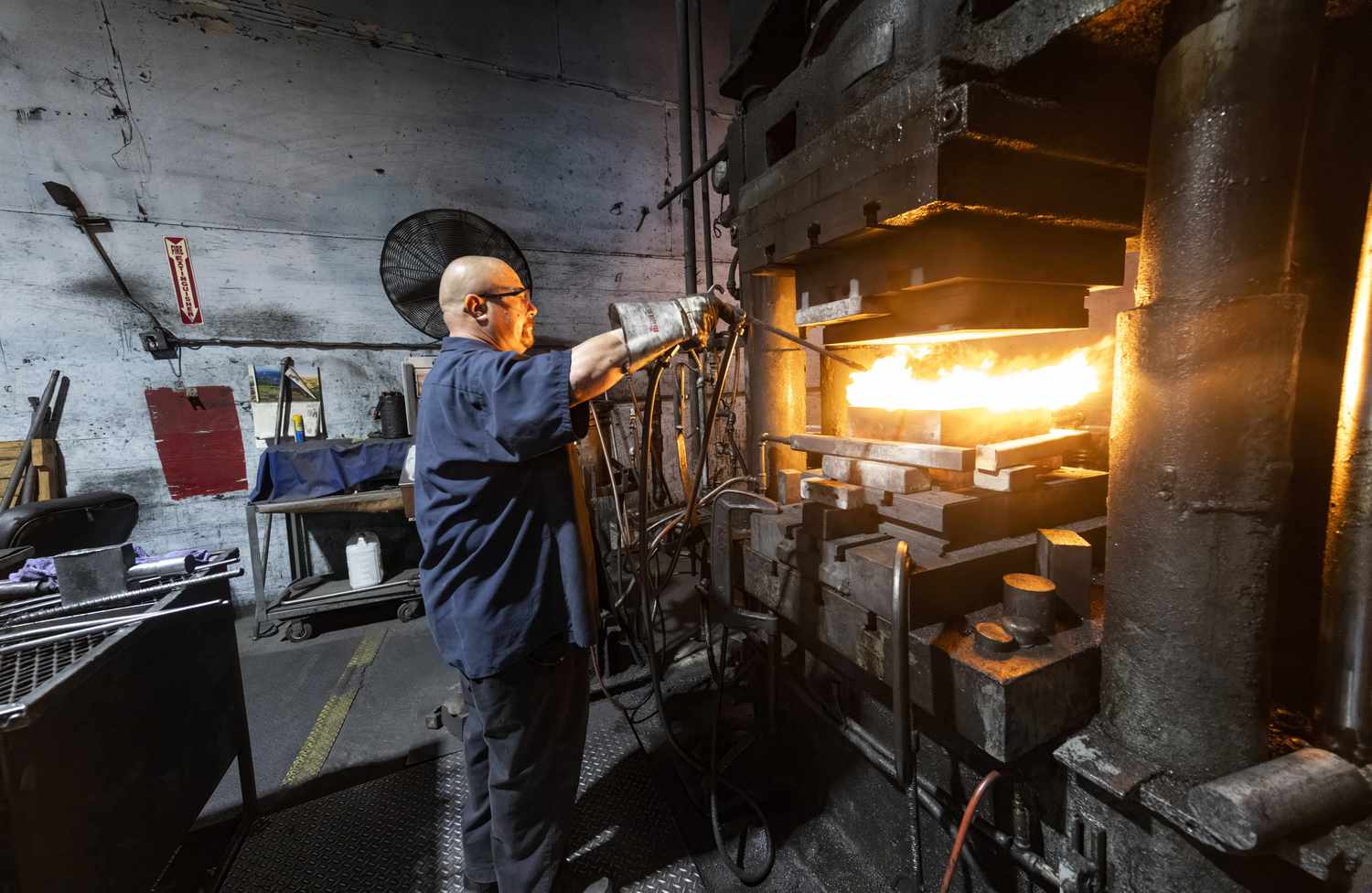 Danny Flores operates a hydraulic forging press at Independent Forge Co. in Orange, CA on Tuesday, September 24, 2024.