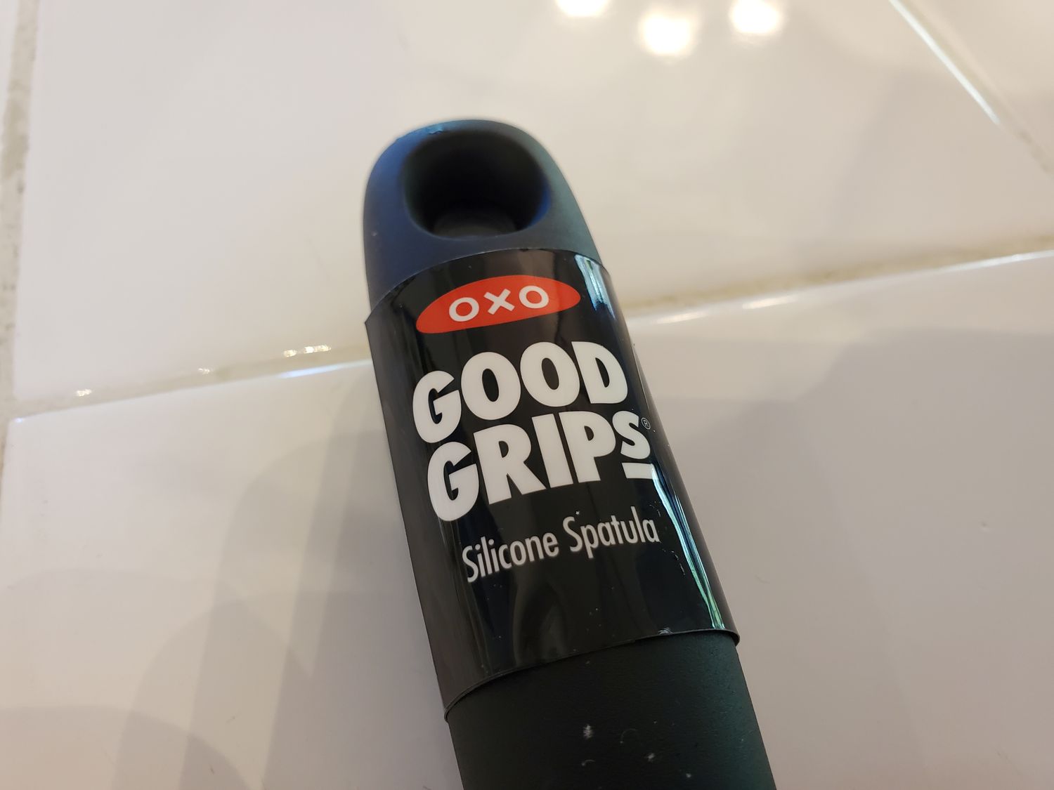 Close-up of logo for OXO Good Grips kitchen utensil