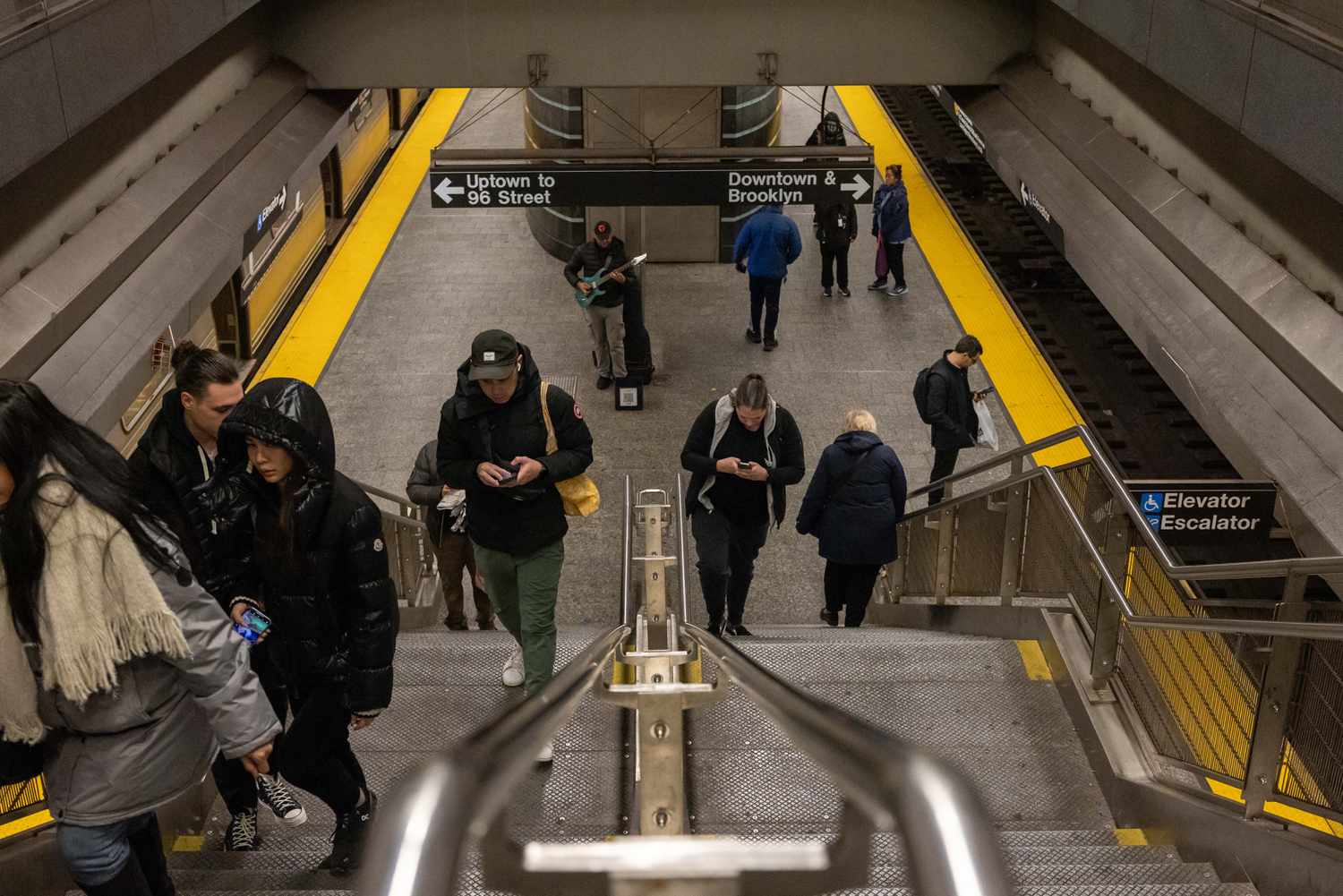 Commuters at the 72nd Street subway station in New York, US, on Friday, Dec. 20, 2024.