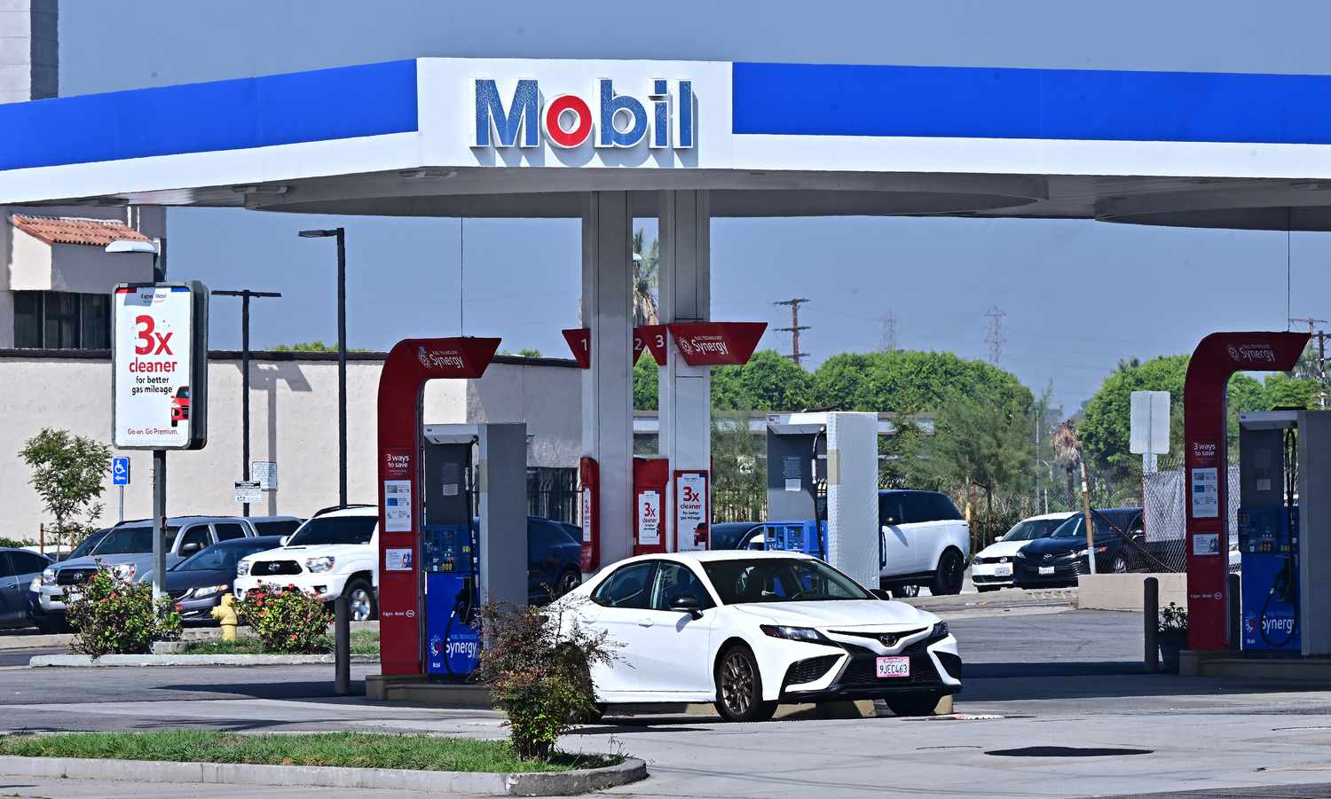 Vehicles pass an ExxonMobil gas station on September 23, 2024 in Rosemead, California