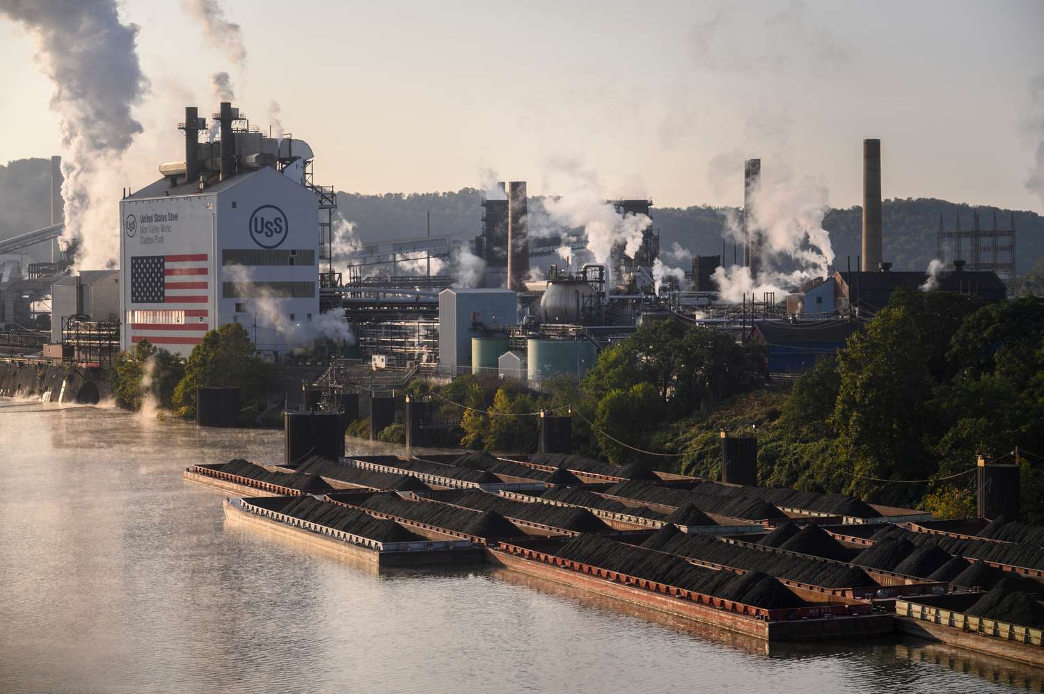 Coal on barges on the Monongahela River near the United States Steel Corp. Clairton Coke Works facility in Clairton, Pennsylvania.