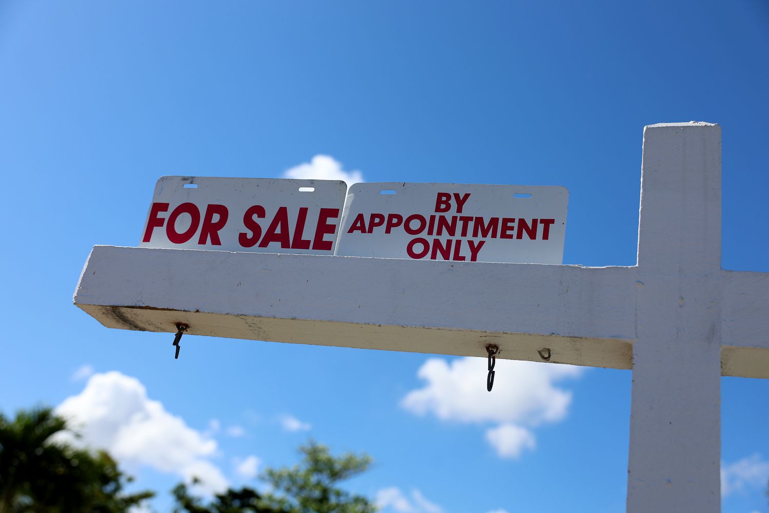 A For Sale sign displayed in front of a home.