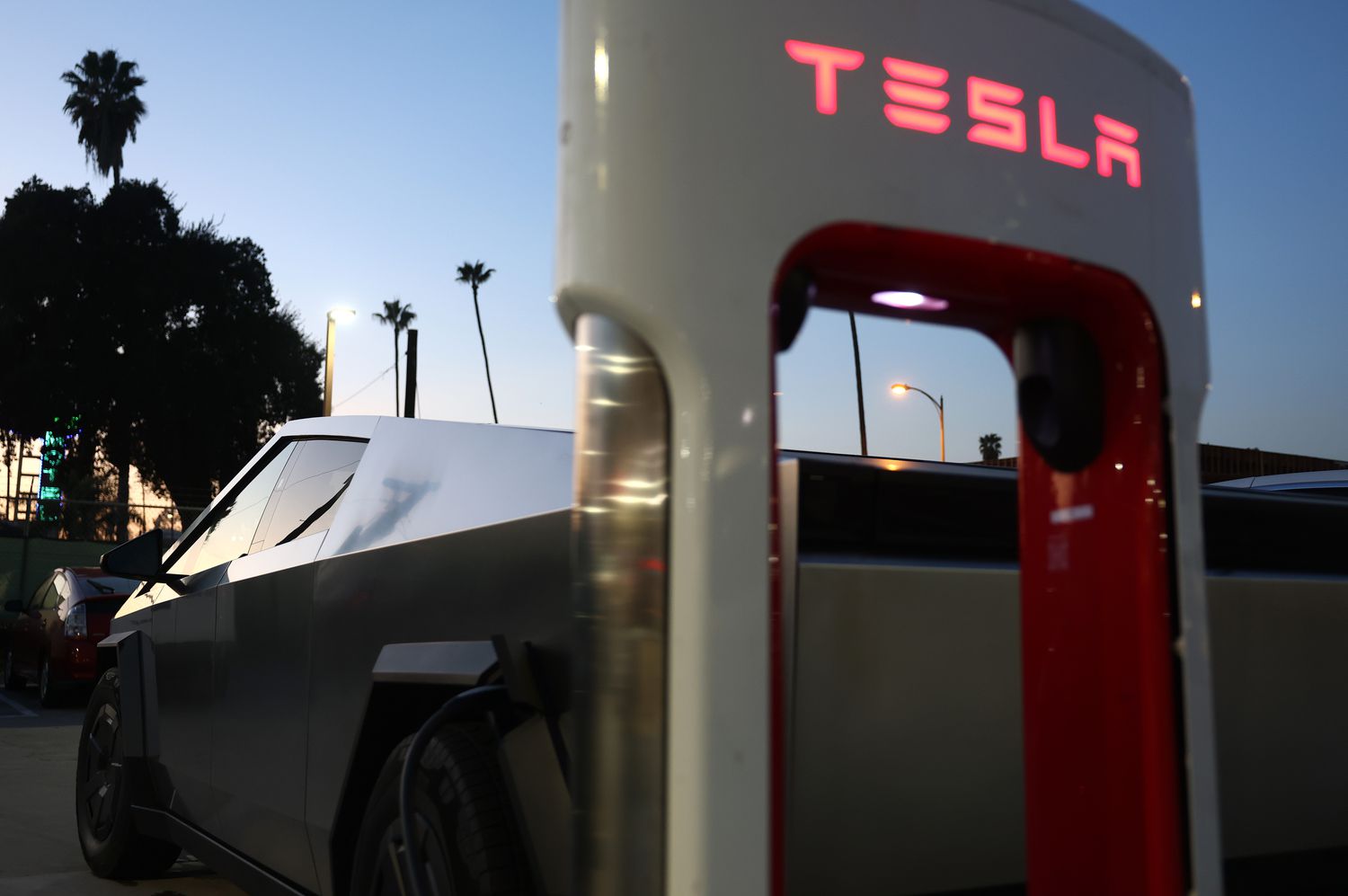 A Tesla Cybertruck recharges at a Tesla Supercharger station on Jan. 2, 2025 in Pasadena, Calif.